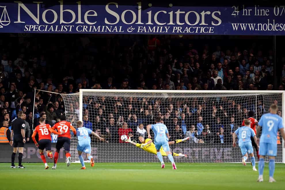 Luton’s Elijah Adebayo scores the opening goal (David Davies/PA)