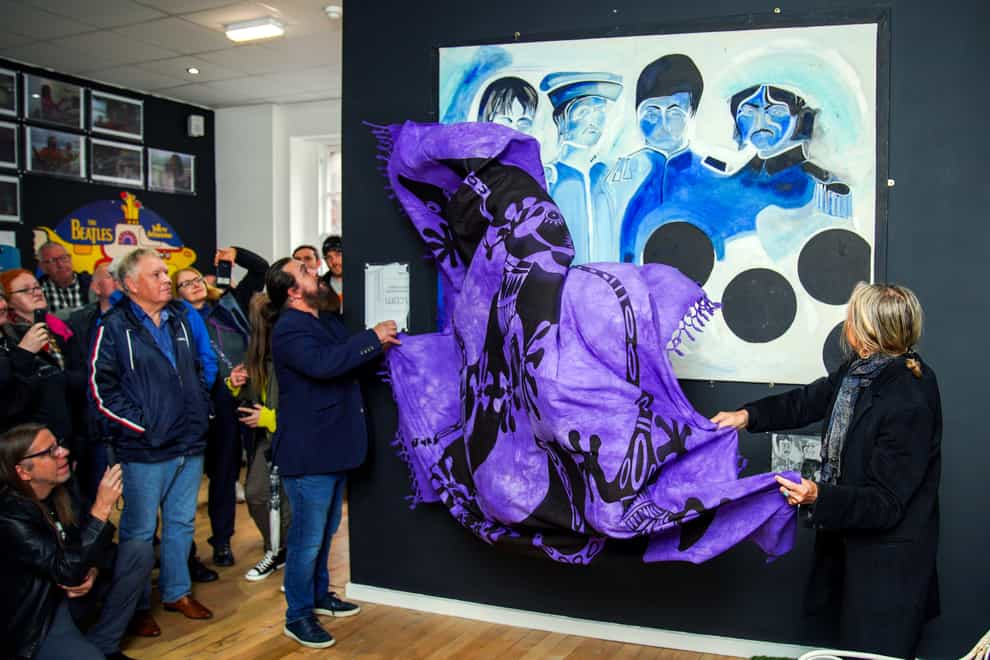A painting of the Beatles by artist Jonathan Hague is unveiled at the Beatles Museum in Liverpool (Peter Byrne/PA)