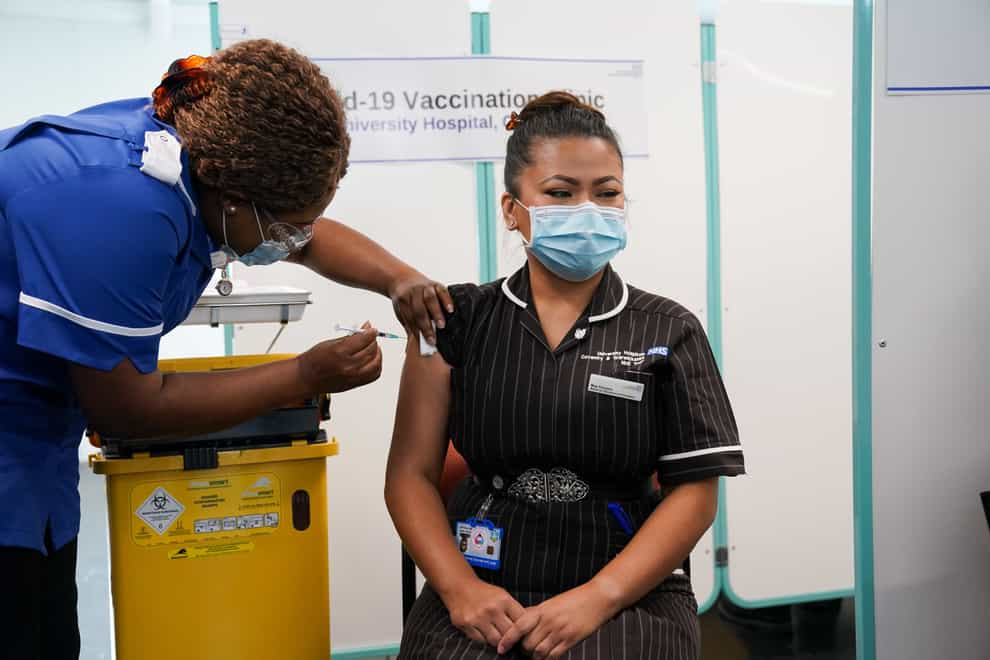 The booster programme is being delivered through existing sites including pharmacies, hospital hubs, GP practices and vaccination centres (Jacob King/PA)