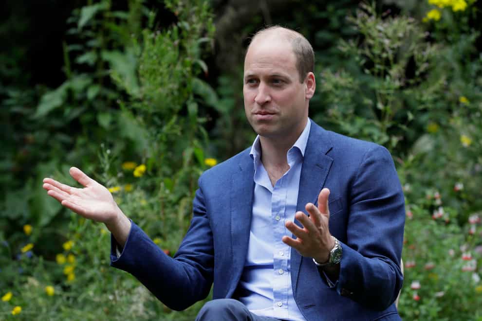 The Duke of Cambridge speaks with service users during a visit to the Garden House part of the Peterborough Light Project, a charity which offers advice and support to rough sleepers (Kirsty Wigglesworth/PA)