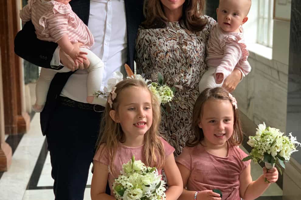 Mariam Ayad and Billy Hookway with their daughters at their wedding in 2019 (Mariam Ayad/PA)