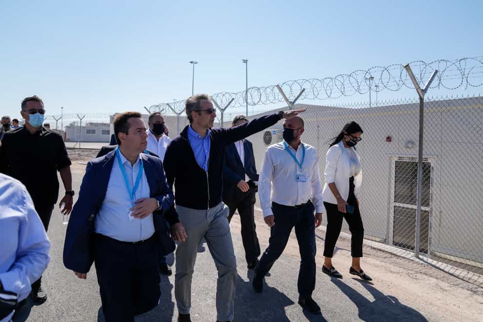 Greece’s Migration Minister Notis Mitarachis and Prime Minister Kyriakos Mitsotakis new facility for migrants and refugees on Samos (Thanassis Stavrakis/AP)