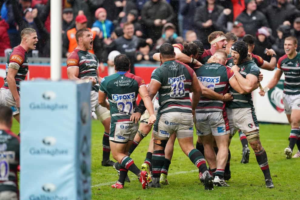 Leicester Tigers players celebrate after being awarded a penalty try to win the game (David Davies/PA)