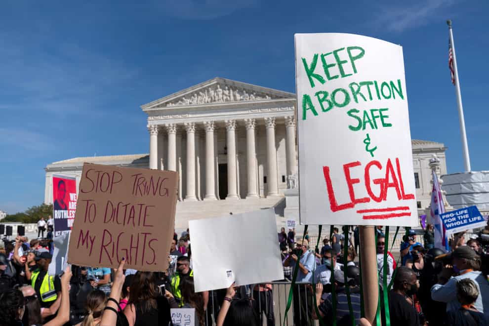 Demonstrators march outside the US Supreme Court during the Women’s March in Washington (Jose Luis Magana/AP)