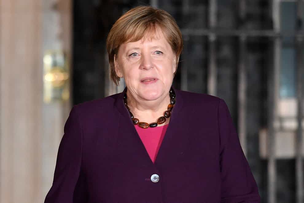 Angela Merkel has said that German reunification is not complete ‘mentally and structurally’ (Daniel Leal-Olivas/PA)