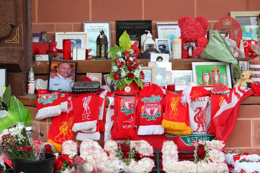 Flowers and tributes left at the Hillsborough Memorial outside Anfield stadium (PA)