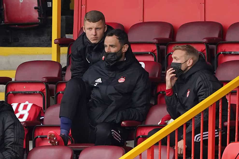 Aberdeen goalkeeper Joe Lewis, centre, among the substitutes (Andrew Milligan/PA)