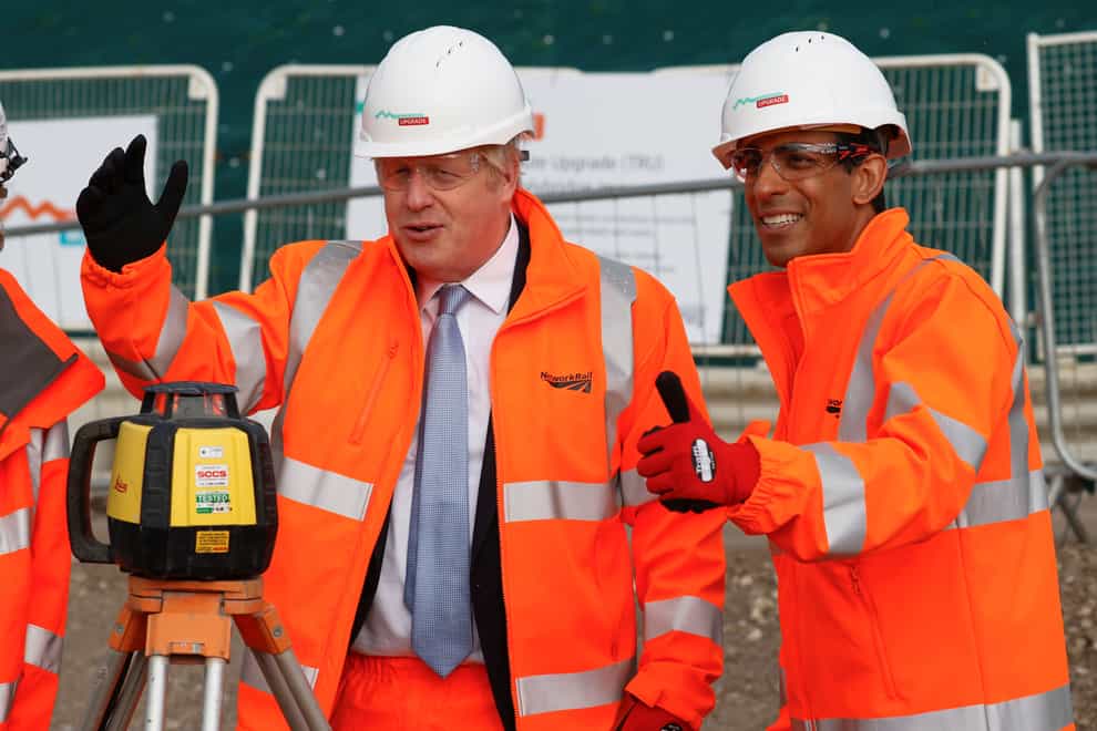 Prime Minister Boris Johnson and Chancellor Rishi Sunak joked about ‘levelling up’ during a Network Rail site visit in Manchester (Phil Noble/PA)