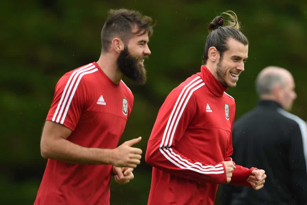 Former Wales midfielder Joe Ledley (left) says the country’s youngsters must handle the loss of Gareth Bale (right) in World Cup qualifiers (Joe Giddens/PA)