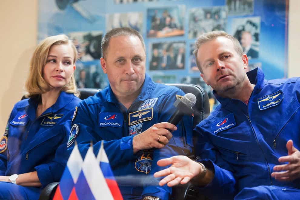 Actress Yulia Peresild, director Klim Shipenko, right, and cosmonaut Anton Shkaplerov (Roscosmos Space Agency via AP)
