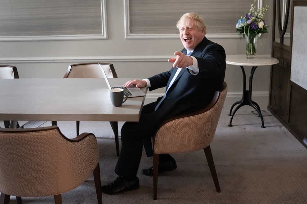 Prime Minister Boris Johnson prepares his keynote speech in his hotel room in Manchester before addressing the Conservative Party Conference on Wednesday (Stefan Rousseau/PA)