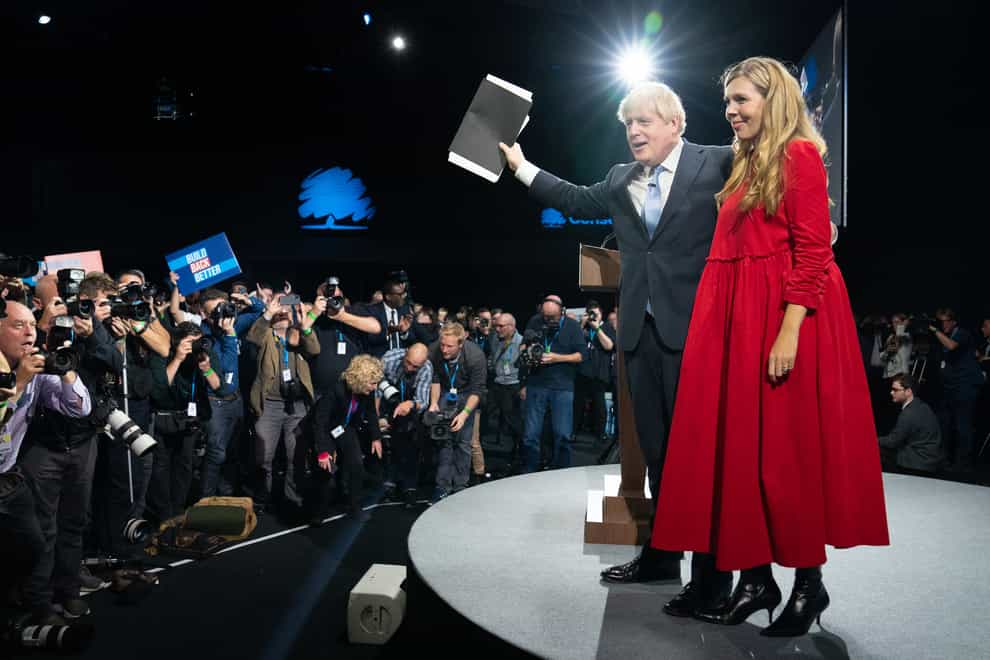 Prime Minister Boris Johnson is joined by his wife Carrie on stage (Stefan Rousseau/PA)