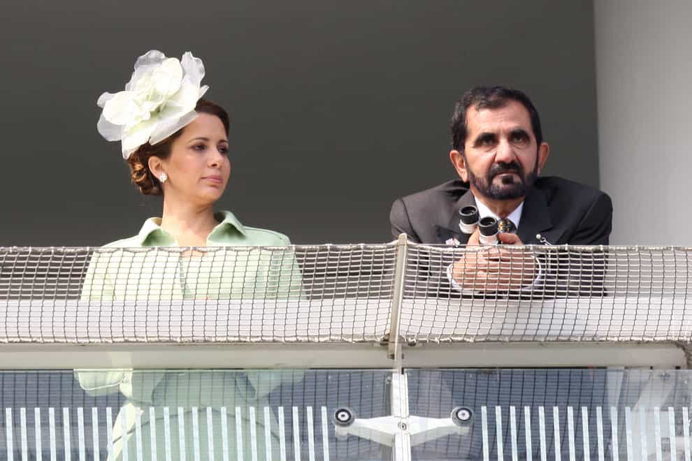 Sheikh Mohammed Bin Rashid Al Maktoum and Princess Haya Bint Al Hussein in the stands at Epsom in 2011 (PA)