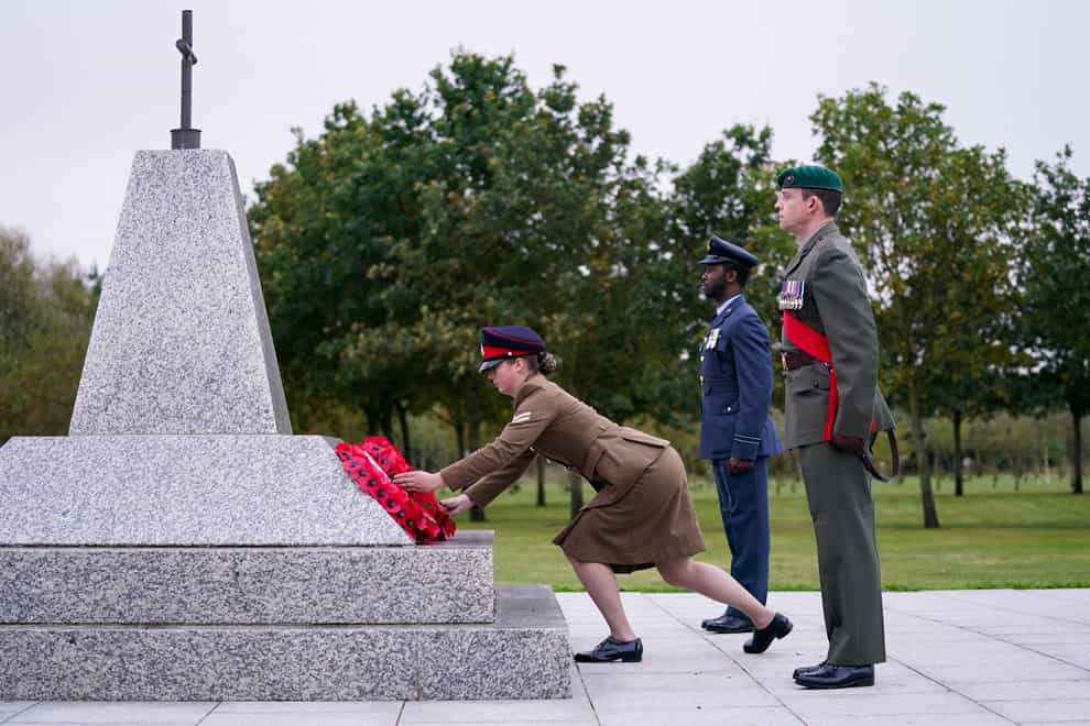 Members of the Armed Forces lay a wreath at the Camp Bastion Memorial to mark 20 years since the start of UK operations in Afghanistan (Jacob King/PA)