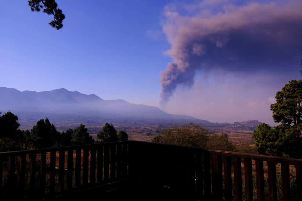 Smoke rises on the horizon as lava flows from a volcano on the Canary island of La Palma, Spain (Daniel Roca/AP)