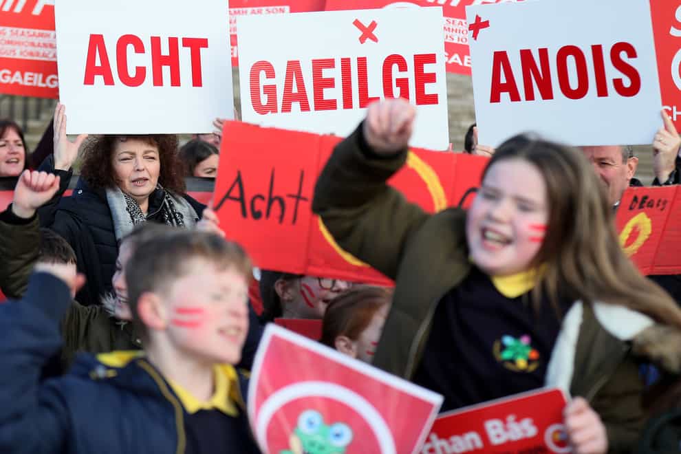 Irish language act campaigners, including pupils from Irish-medium schools across Northern Ireland, take part in a protest at Stormont (Brian Lawless/PA)