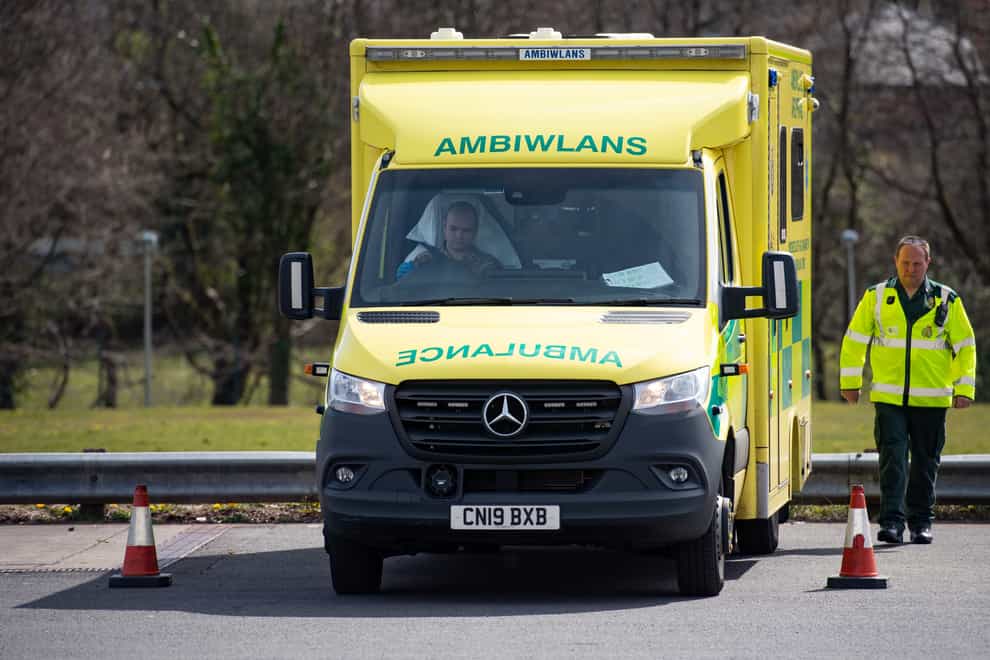 Ambulances face long waits outside Welsh hospitals while patients are transferred over (Jacob King/PA)