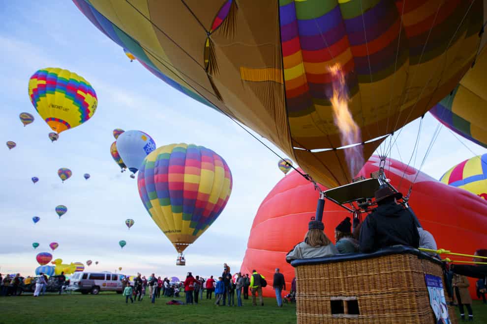 A balloon launches at the Albuquerque Balloon Fiesta (Nadav Soroker/The Albuquerque Journal via AP)