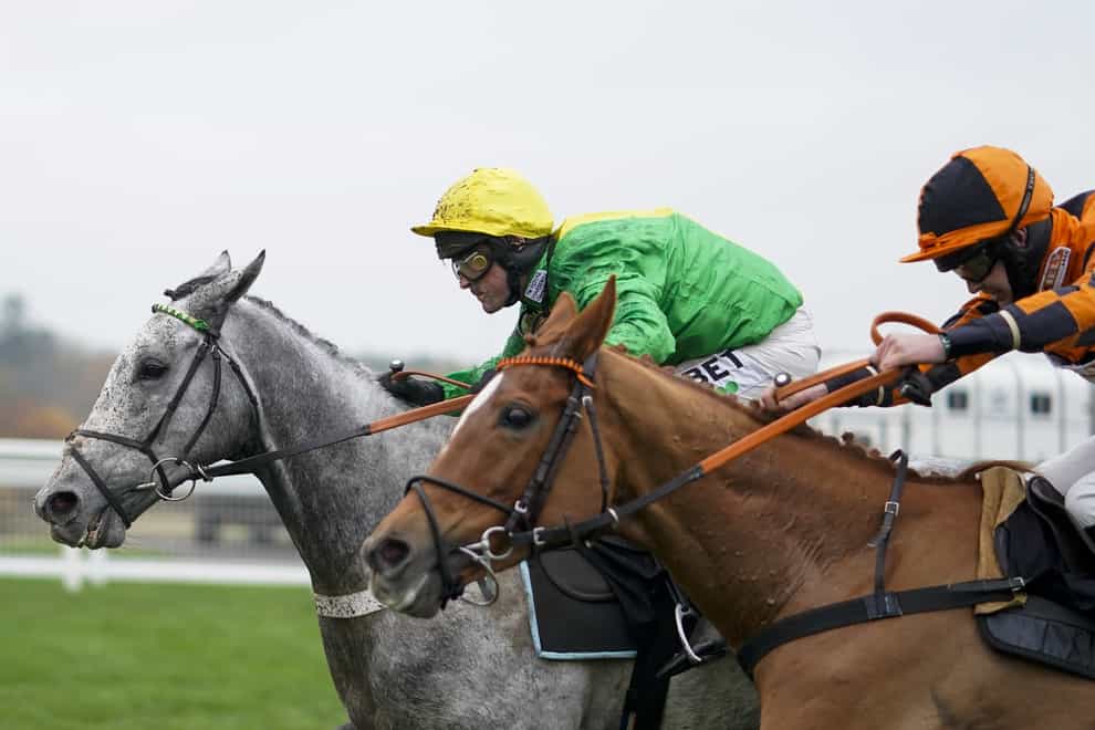 Buzz and Nico de Boinville (left) winning the Coral ‘Fail To Finish’ Free Bet Handicap Hurdle at Ascot (PA)