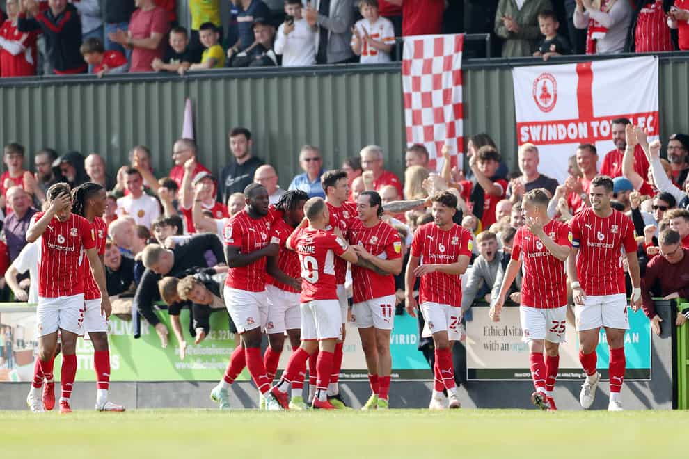 Swindon’s Harry McKirdy celebrates scoring their first goal against Forest Green (Bradley Collyer/PA)