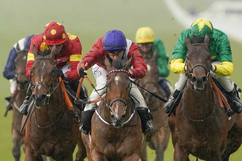 Tom Marquand riding Canonized (centre, red) win The South Downs Water EBF Restricted Novice Stakes at Goodwood Racecourse in Chichester. Picture date: Friday April 30, 2021 (Alan Crowhurst/PA)