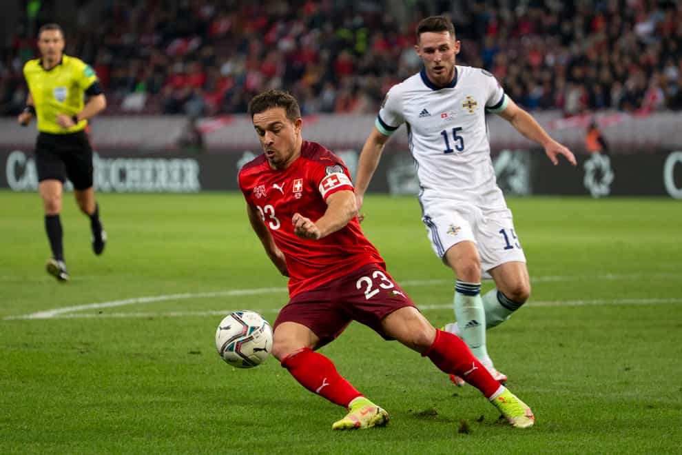 Switzerland’s Xherdan Shaqiri, left, controls the ball past Northern Ireland midfielder Jordan Thompson (Salvatore Di Nolfi/AP)