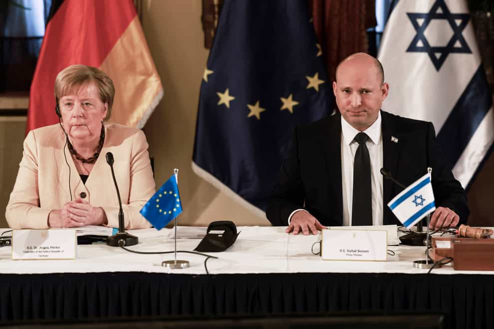 German Chancellor Angela Merkel attends a cabinet meeting with Israeli Prime Minister Naftali Benett in Jerusalem (Menahem Kahana/Pool/AP)