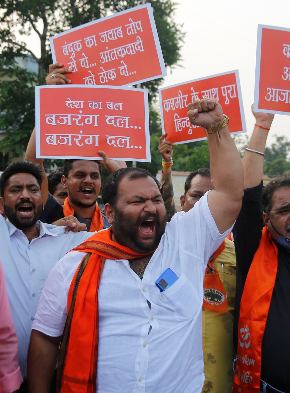 Supporters of Hindu right-wing Vishwa Hindu Parishad (VHP) or World Hindu Council and Bajrang Dal hold placards as they shout slogans during a protest in Ahmedabad against the recent targeted killings of civilians in Indian-controlled Kashmir (Ajit Solanki/AP)