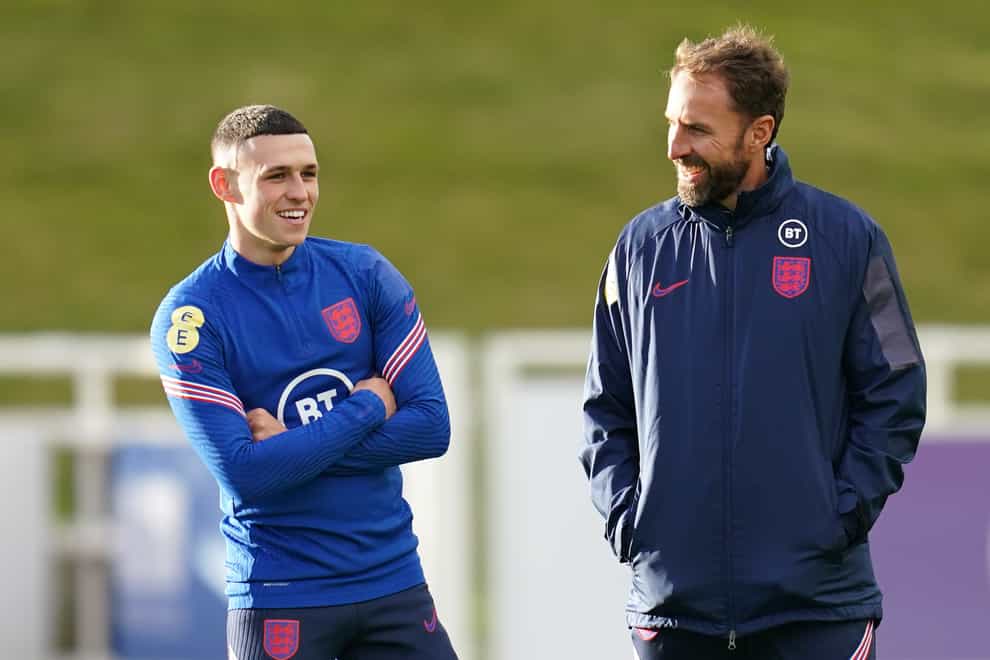 England manager Gareth Southgate (right) is eager not to put too much pressure on Phil Foden (Nick Potts/PA).