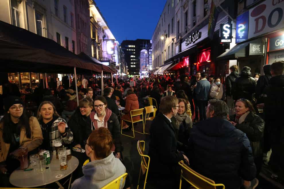 People gather for drinks and food in Old Compton Street, Soho, central London (Jonathan Brady/PA)