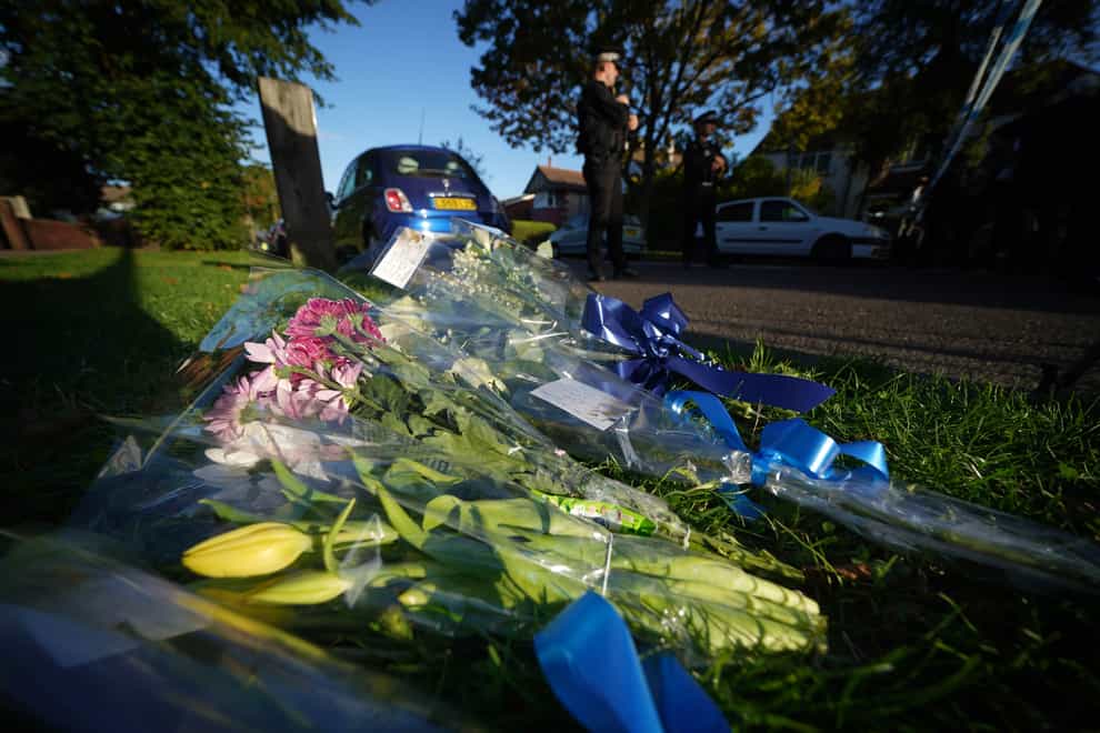 Flowers at the scene near the Belfairs Methodist Church in Eastwood Road North, Leigh-on-Sea, Essex, where Conservative MP Sir David Amess has died after he was stabbed several times at a constituency surgery (Yui Mok/PA)