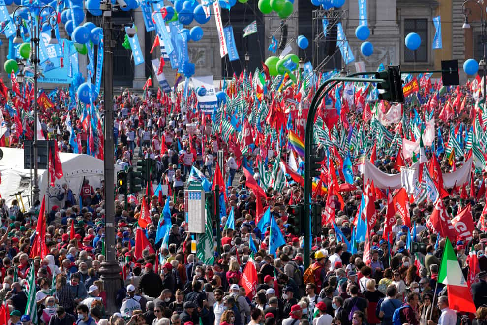Demonstrators take part in a march organised by Italy’s main labour unions, in Rome’s S. John Lateran square (Andrew Medichini/AP)