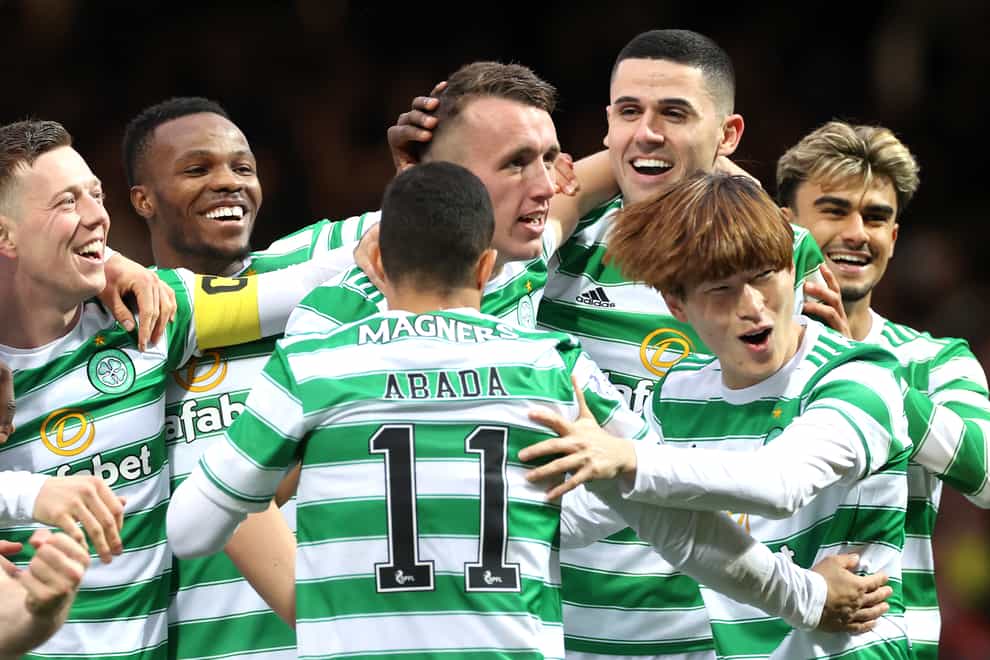 Celtic’s David Turnbull (centre) is mobbed by team-mates after scoring against his former club (Steve Welsh/PA)