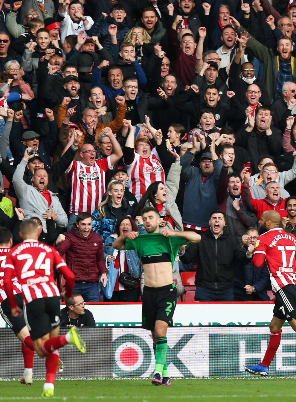 Sheffield United’s David McGoldrick (right) celebrates scoring the winning goal against Stoke (Isaac Parkin/PA)