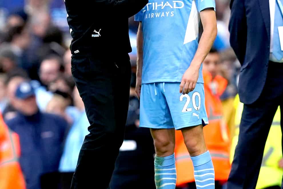 Manchester City manager Pep Guardiola speaks to Bernardo Silva at the end of the match (Martin Rickett/PA)