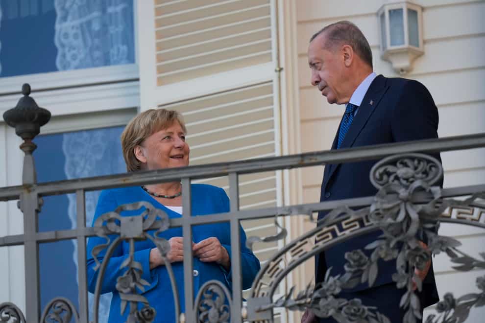 Turkey’s President Recep Tayyip Erdogan, right, talks to German Chancellor Angela Merkel during their meeting at Huber Villa presidential palace, in Istanbul, Turkey, Saturday, October 16 (Francisco Seco/AP)
