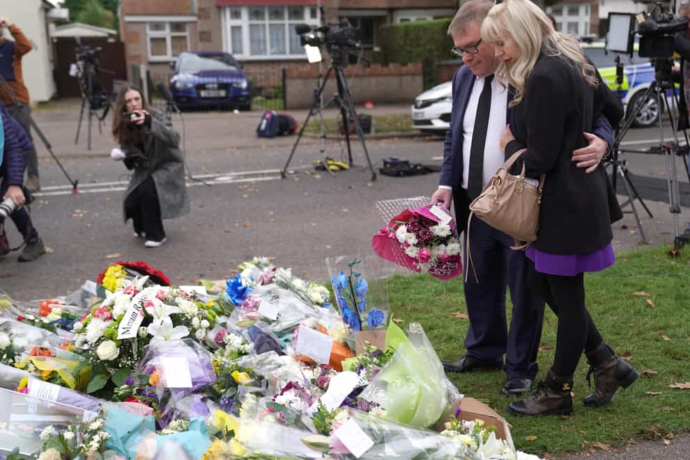 MP Mark Francois lays flowers at the scene near Belfairs Methodist Church in Eastwood Road North, Leigh-on-Sea, Essex (Kirsty O’Connor/PA)