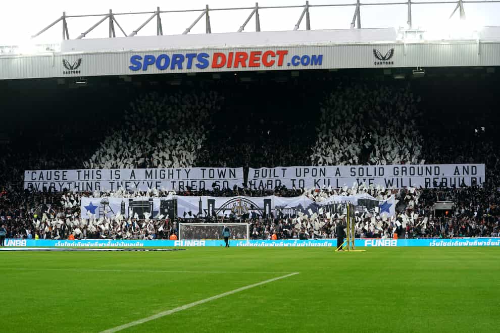 Newcastle fans unveil a banner quoting Jimmy Nail (Owen Humphreys/PA)