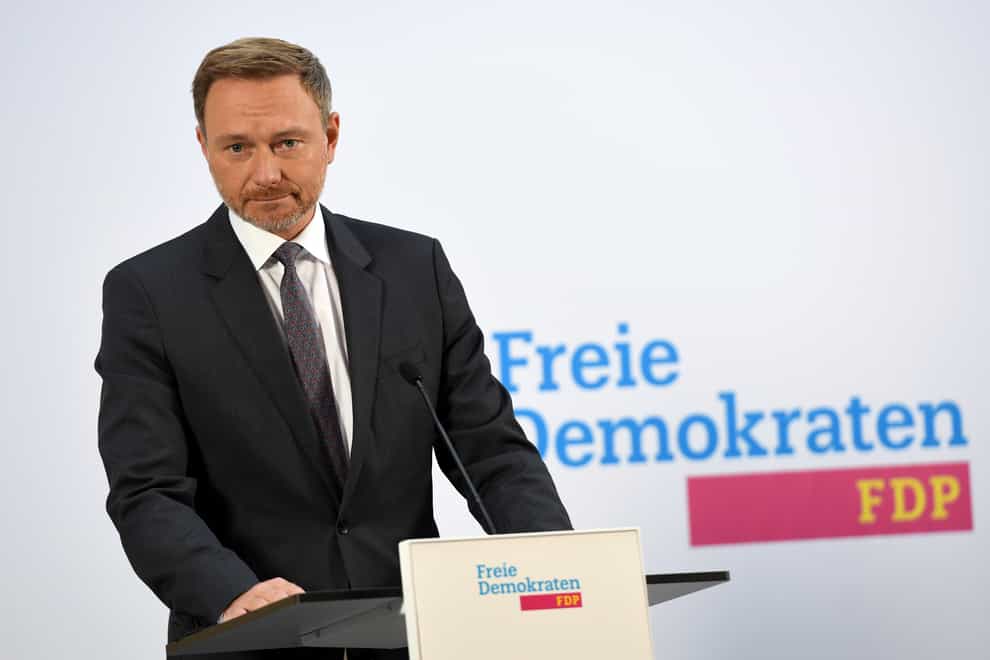Christian Lindner, parliamentary party leader and party chairman of the FDP, makes a statement (Paul Zinken/AP)