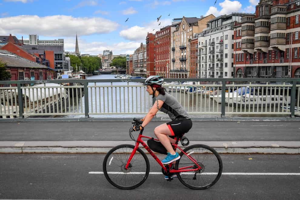 A cyclist crosses a bridge in Bristol (Ben Birchall/PA)