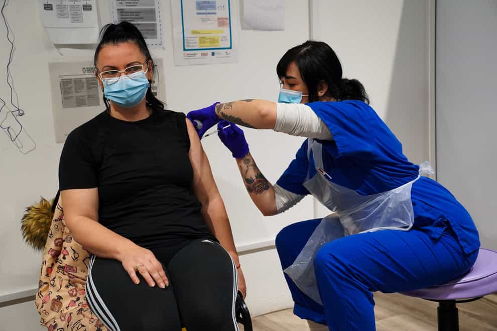 A person receives a Covid-19 Pfizer jab at a pop-up vaccination centre (Kirsty O’Connor/PA)