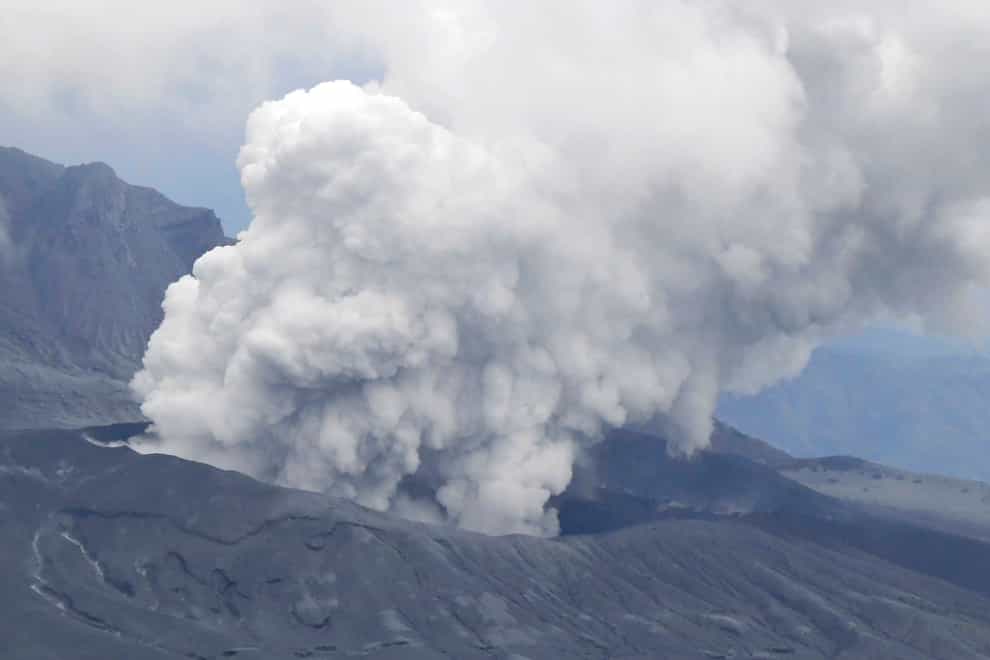 Smokes rise from a crater of Mt Aso after its eruption, observed from Kusasenri, southwestern Japan (Kyodo News/AP)