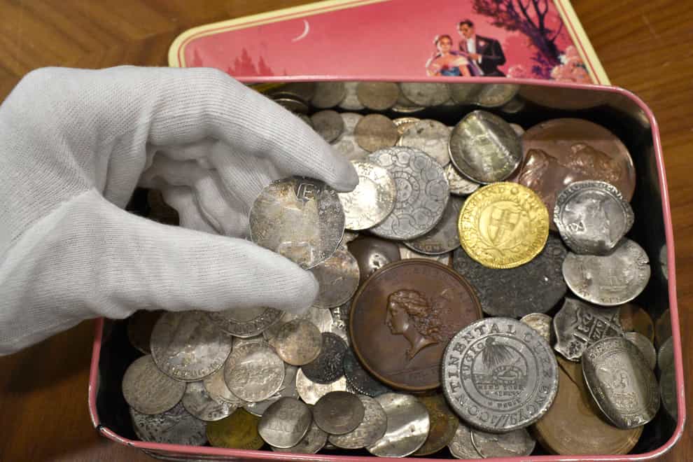 The tin of old coins (Morton & Eden/PA)