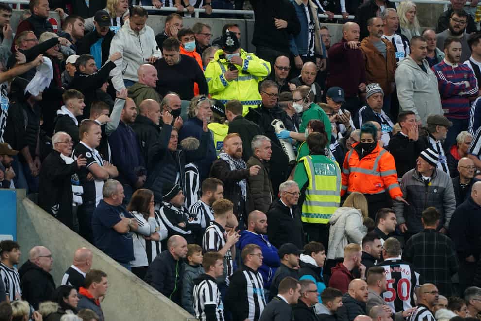 Medical personnel are called to assist a fan in the stands at St James’ Park (Owen Humphreys/PA)