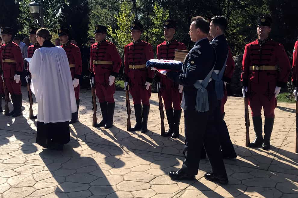 RAF officers carry a wreath and the remains of Sergeant Peter Twiddy during the burial ceremony in Tirana (AP Photo/Llazar Semini)