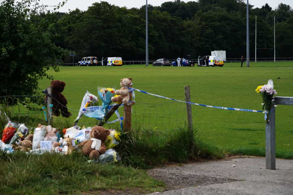 Tributes left at the scene in the Sarn area of Bridgend, south Wales, near where five-year-old Logan Mwangi was found dead (PA)