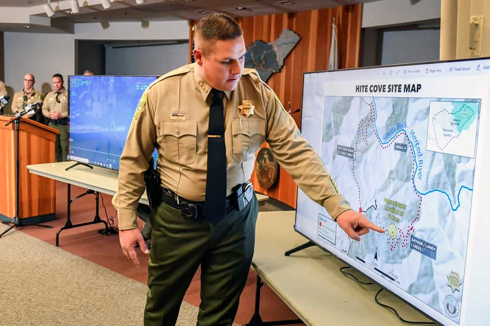 Sheriff Jeremy Briese shows where the family was found (Craig Kohlruss/The Fresno Bee via AP)