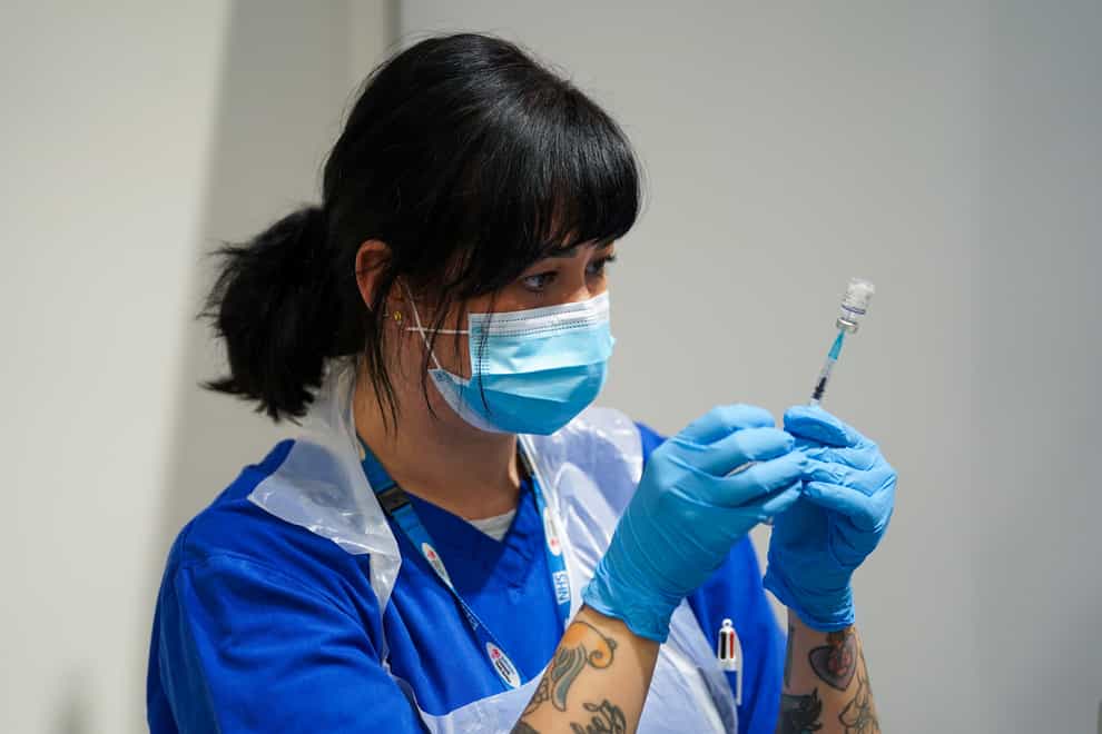 A Covid-19 Pfizer jab is prepared at a pop-up vaccination centre (Kirsty O’Connor/PA)