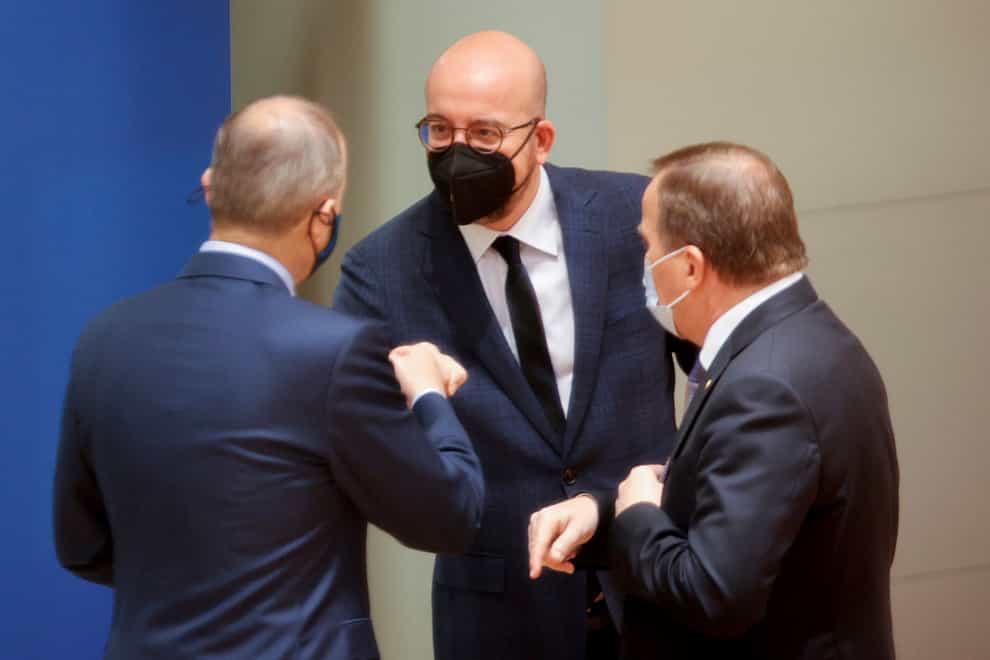 European Council President Charles Michel, centre, with Sweden’s prime minister Stefan Lofven, right, during the meeting (Olivier Matthys, Pool/AP)