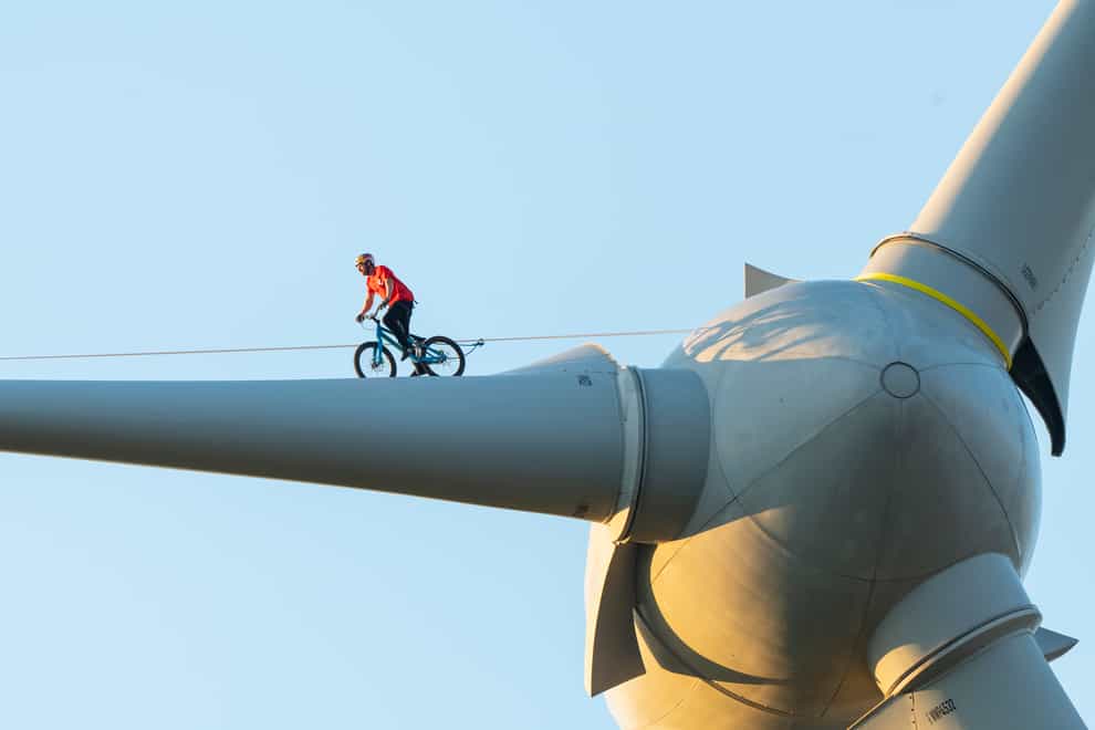 Danny Macaskill cycles across the turbine (The Climate Games/Danny MacAskill)